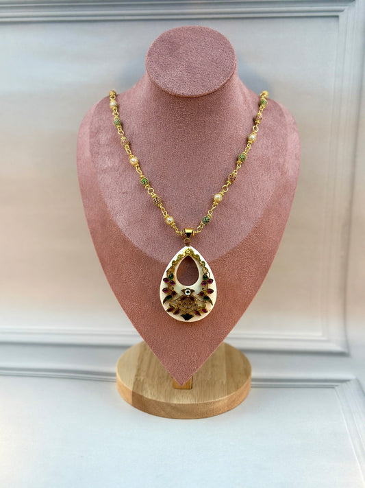 Big White Oval Shaped Pendant With Gold Work
