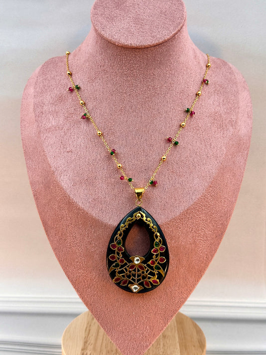 Big Black Oval Shaped Pendant With Gold Work